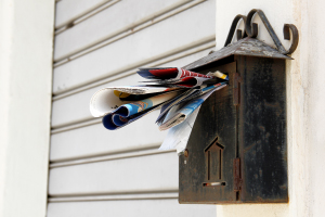 piled up mail in your mail box